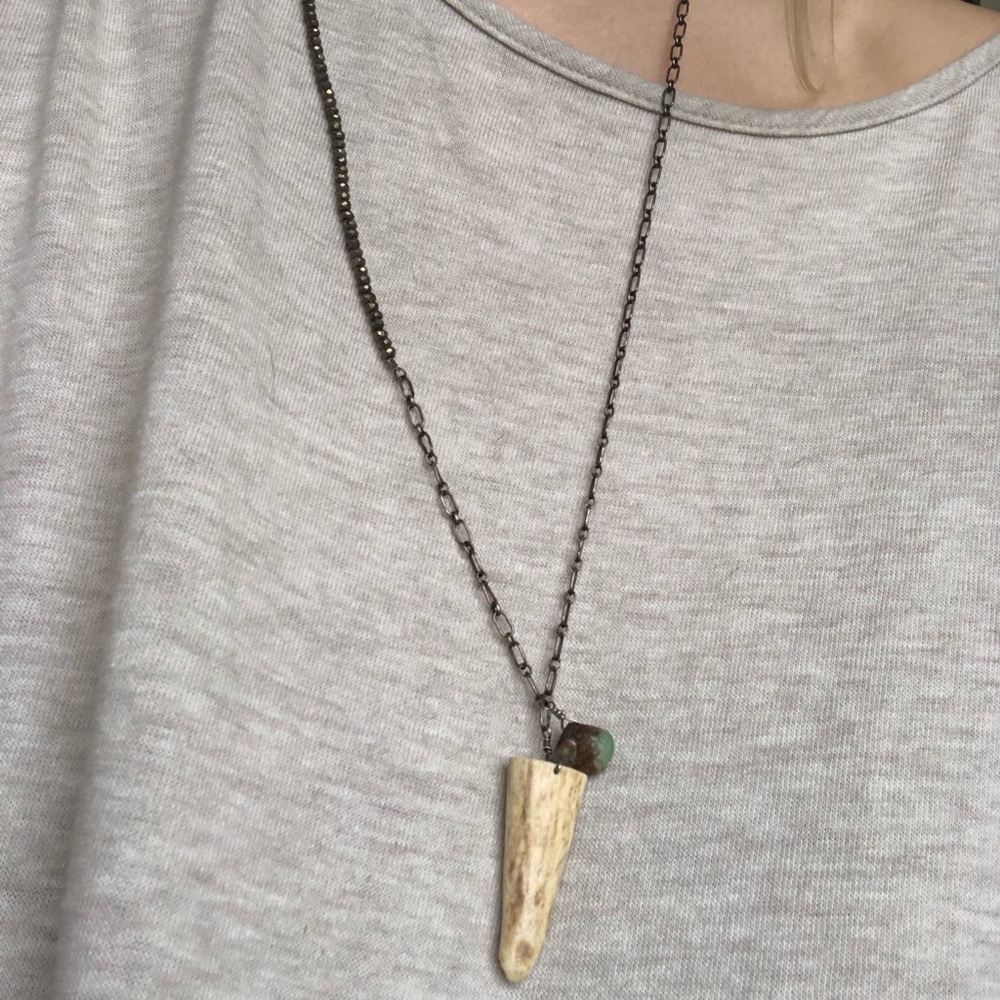 Chain and beaded necklace with bone horn charm
